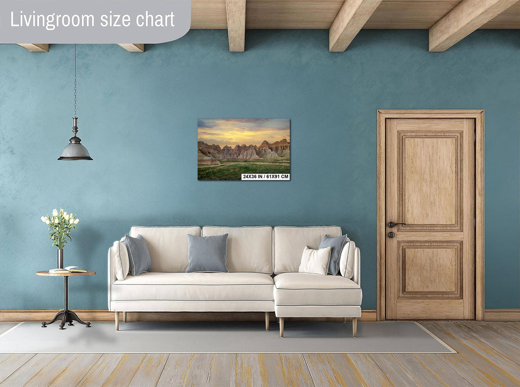 Living room with a beige sectional sofa, side table, and wall art on a blue wall.