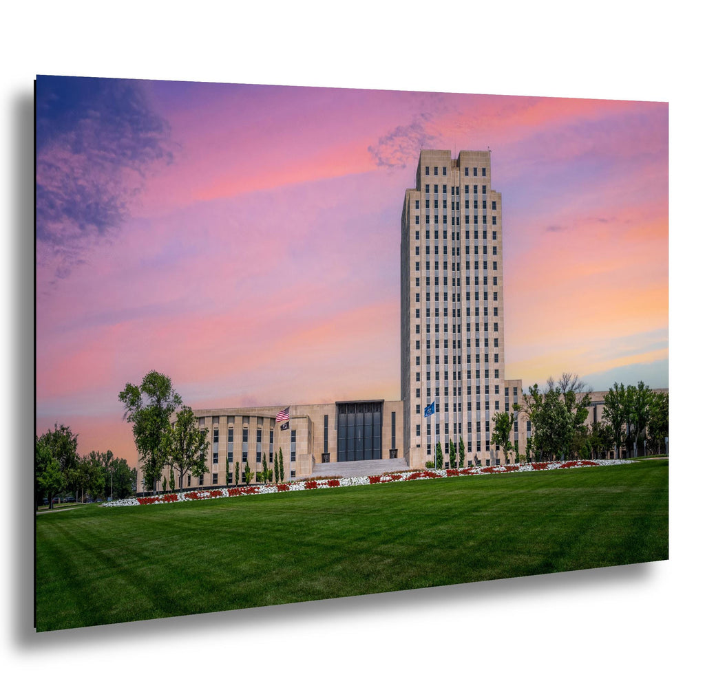 North Dakota State Capitol tower in Bismarck at sunset with vivid evening sky.
