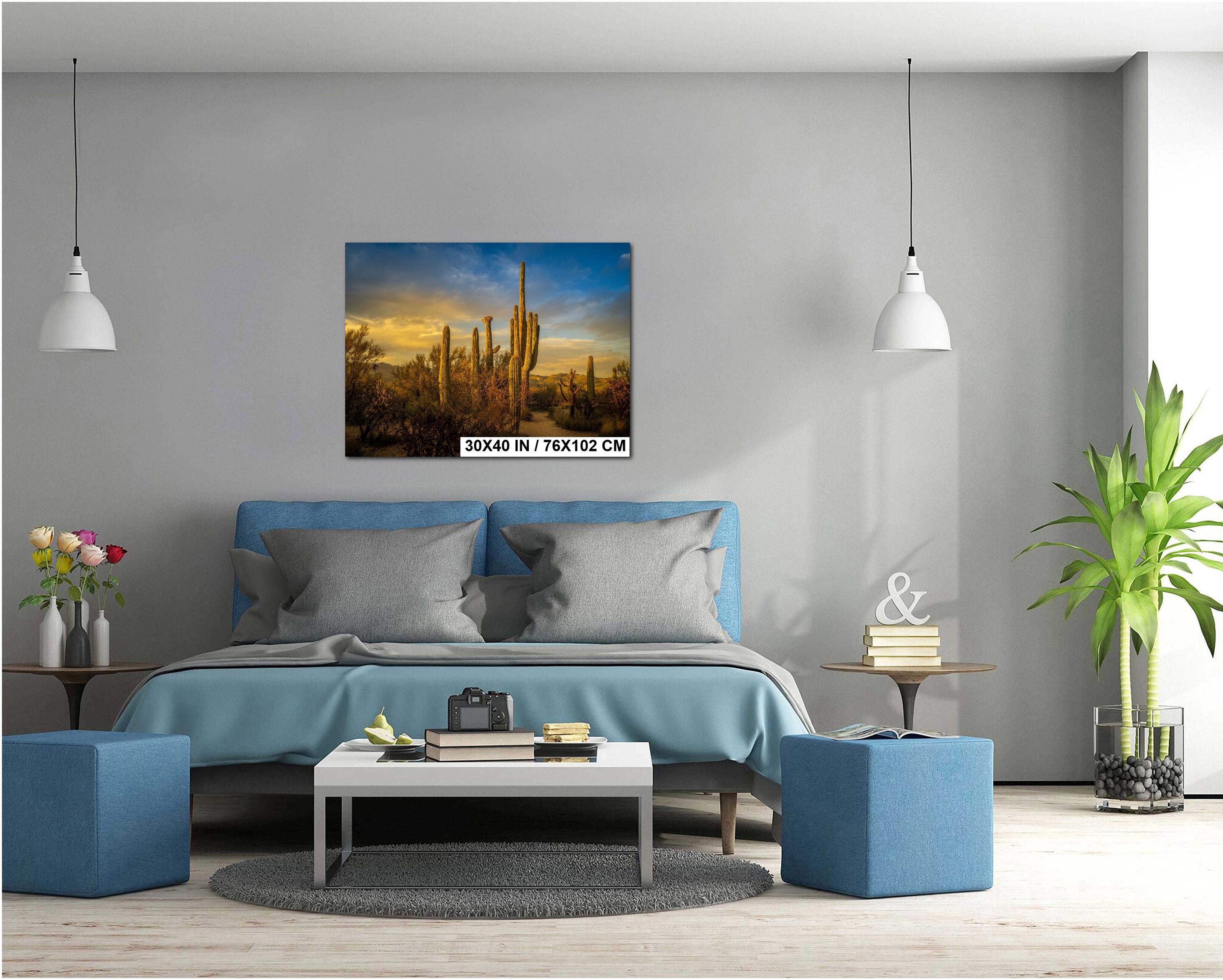 Modern living room with blue sofa, coffee table, and decorative items.