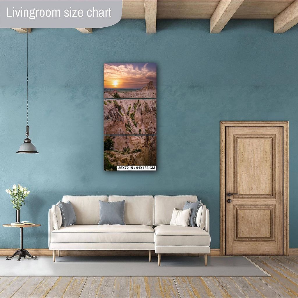 Living room with a sofa, side table, and wall art against a blue wall.