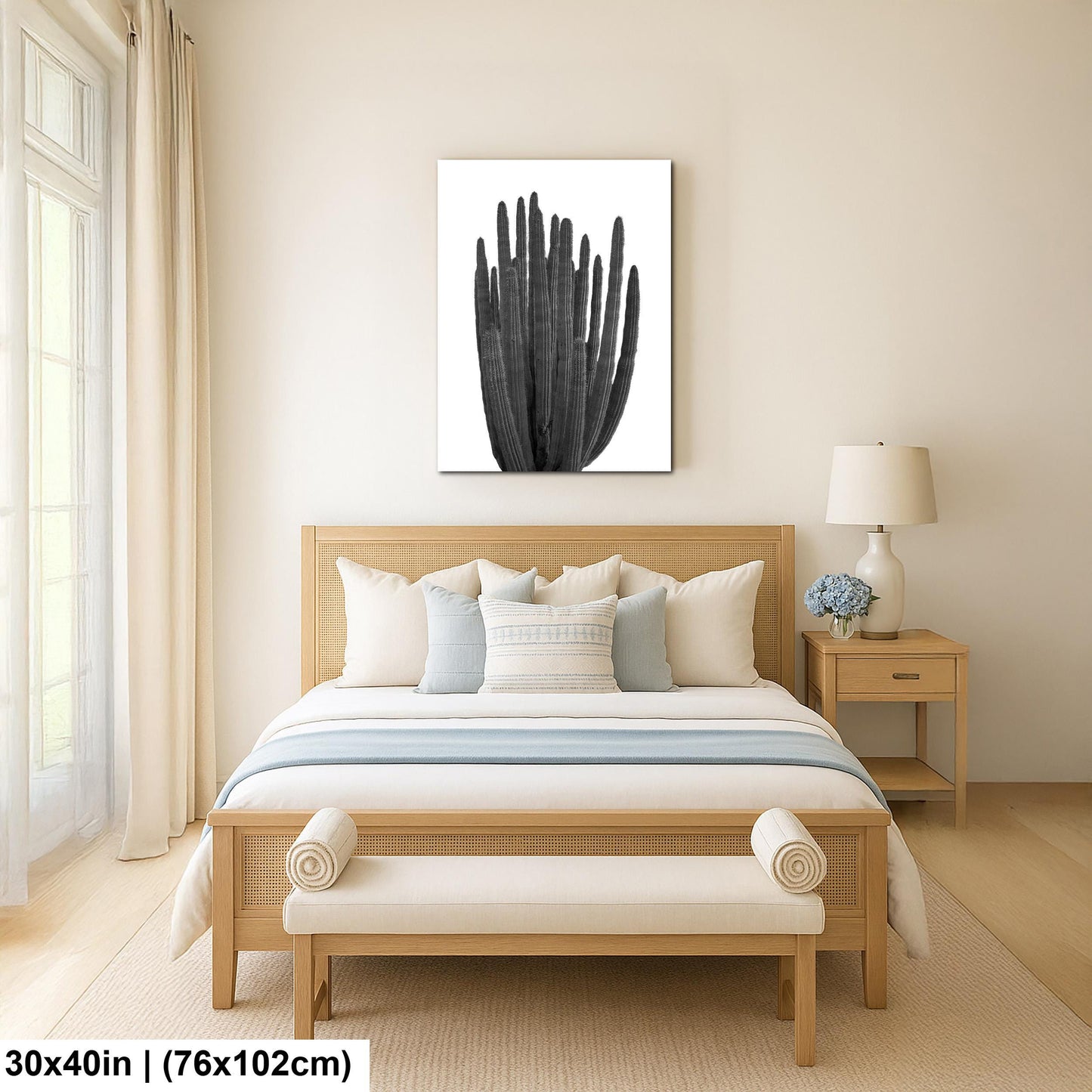 Bedroom with wooden bed, bench, and nightstand with a cactus artwork on the wall.