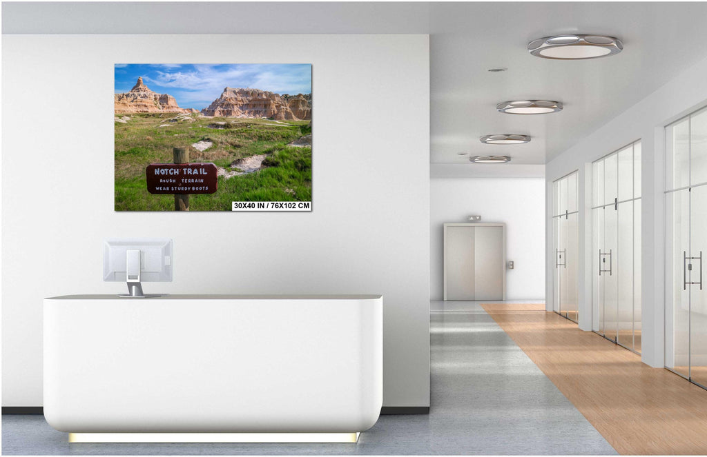 Modern office interior with a large screen displaying a scenic landscape.