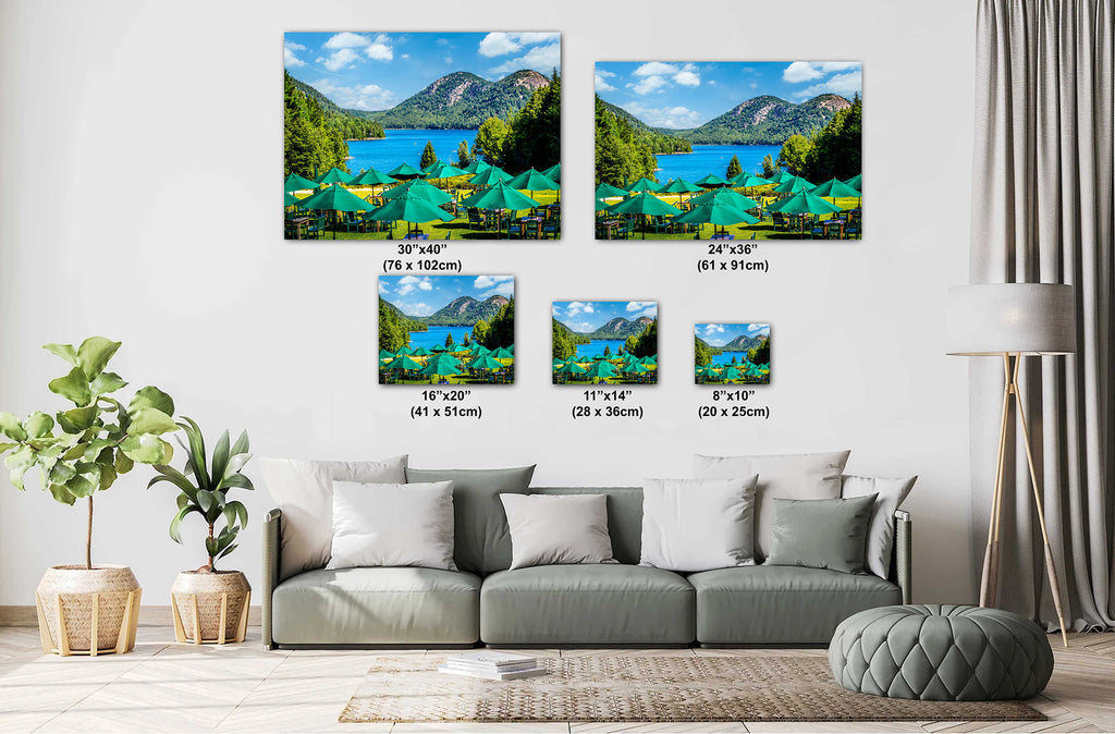 Living room with a sofa and decorative wall art depicting a scenic lake and mountains.