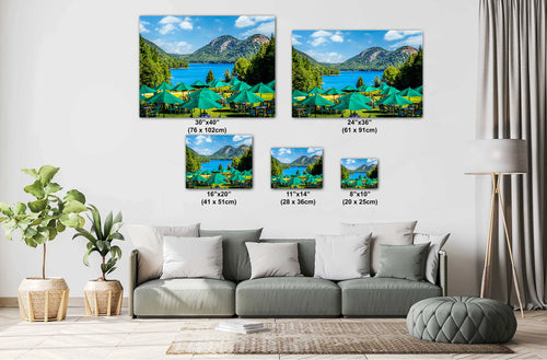 Living room with a sofa and decorative wall art depicting a scenic lake and mountains.