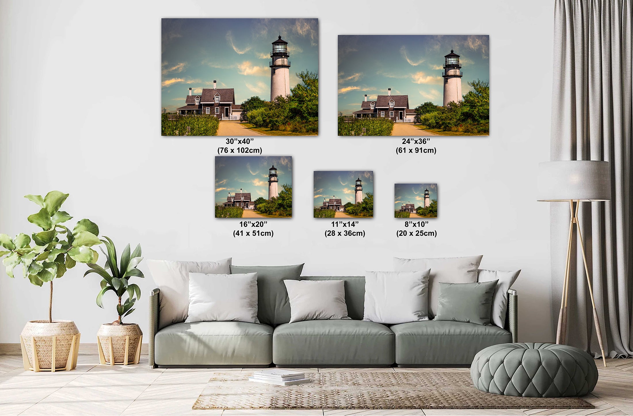 Living room with a sofa and decorative plants, featuring Cape Cod Highland Lighthouse framed wall arts.