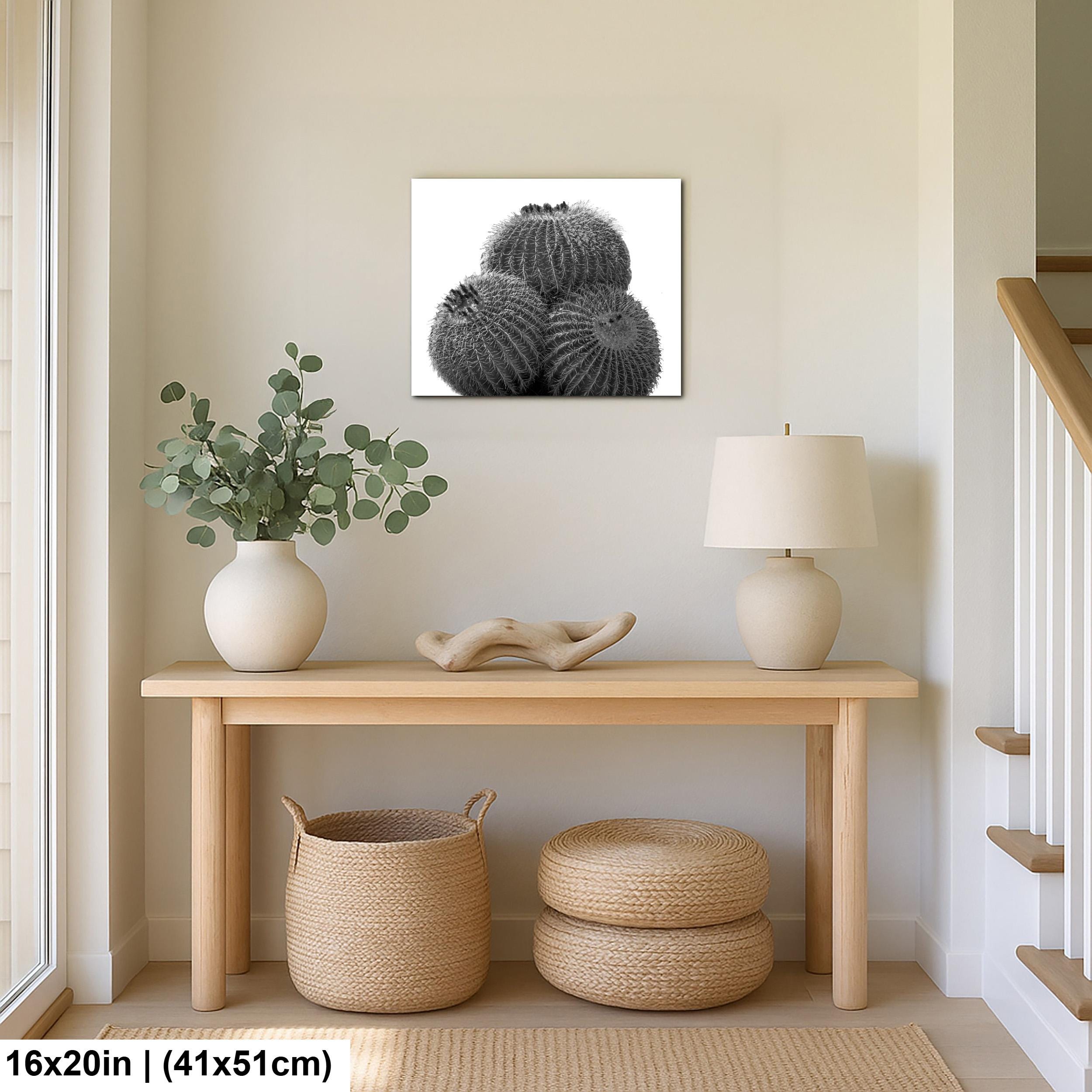 Nestled entryway with a wooden console table, lamp, plant, and decorative items against a beige wall.