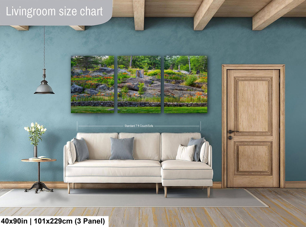 Living room with a sofa, side table, and wall art on a blue wall.