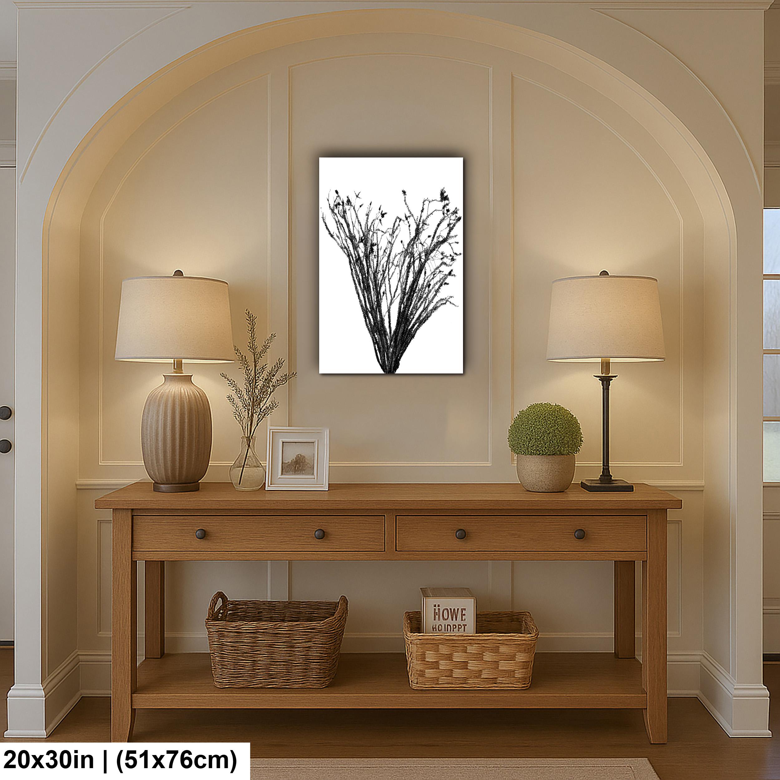 Wooden console table with lamps, decor items, and a framed picture in a room with archway.