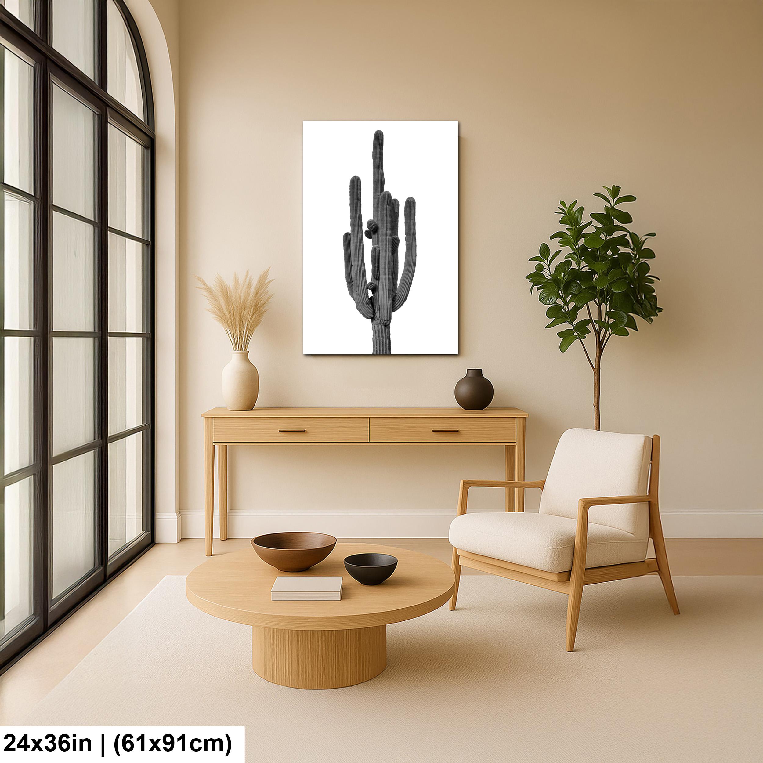 Modern living room with wooden furniture, a cactus print, and a plant.