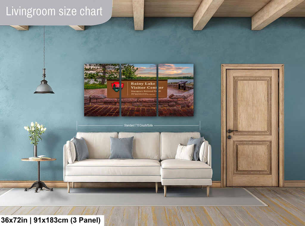 Living room with a large wall art piece and a sofa.