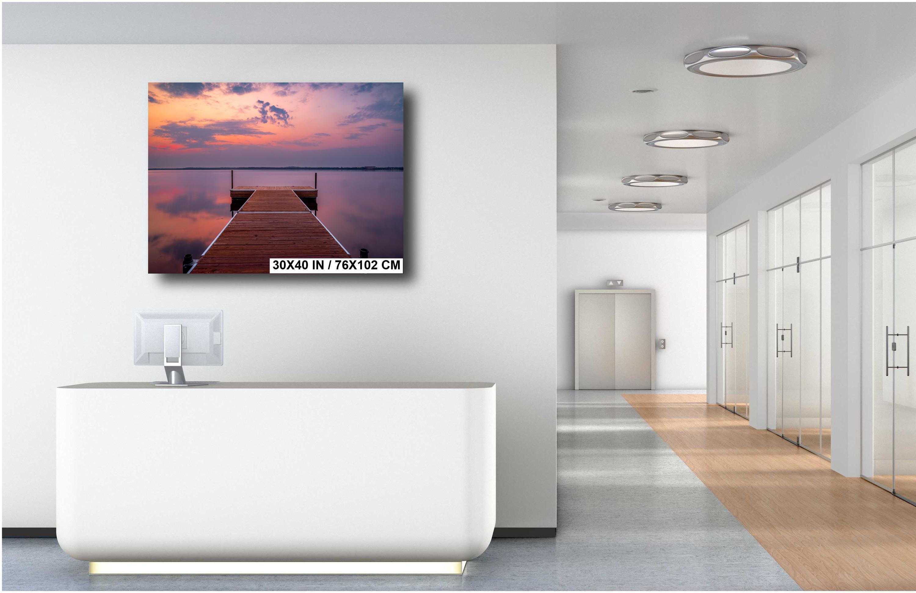 Sunset over calm Lake Bemidji with dock view and pastel skies before a summer storm wall art hanging.