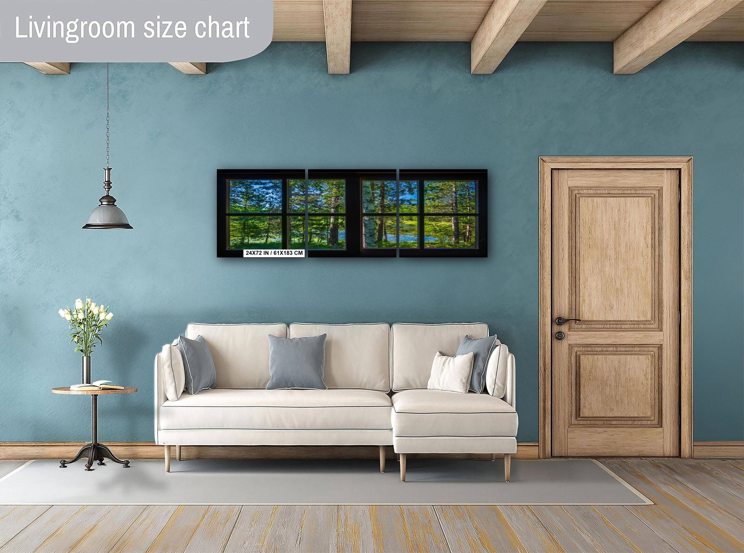 Living room with a beige sectional sofa, side table, and wall art on a blue wall.