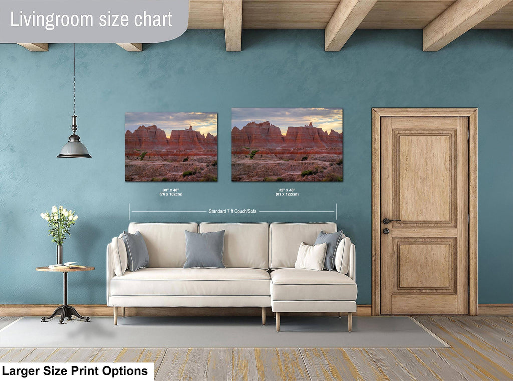Living room with a sofa, side table, and two wall art prints on a blue wall.