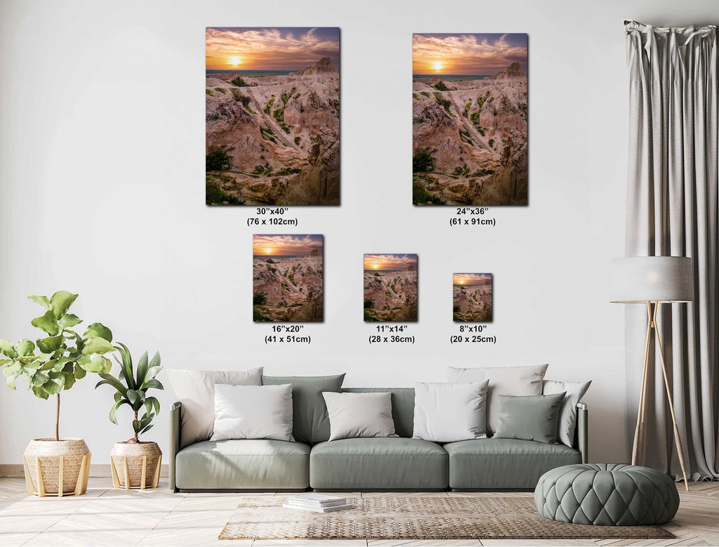 Living room with wall art displaying various sizes of sunset over a beach scene.