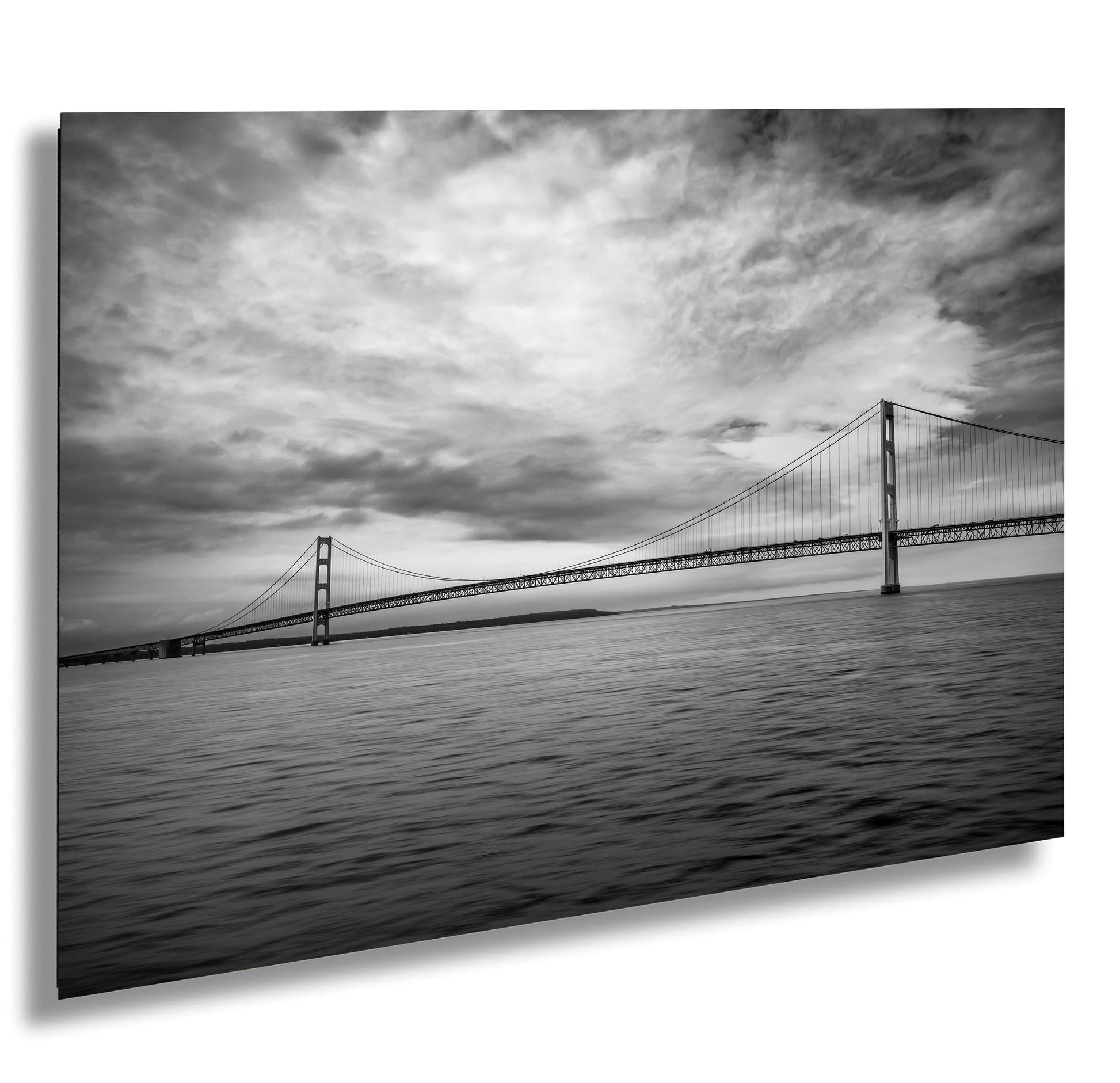 Black and white photograph of the Mackinac Bridge spanning the Straits of Mackinac from Michigan's Upper to Lower Peninsulas.