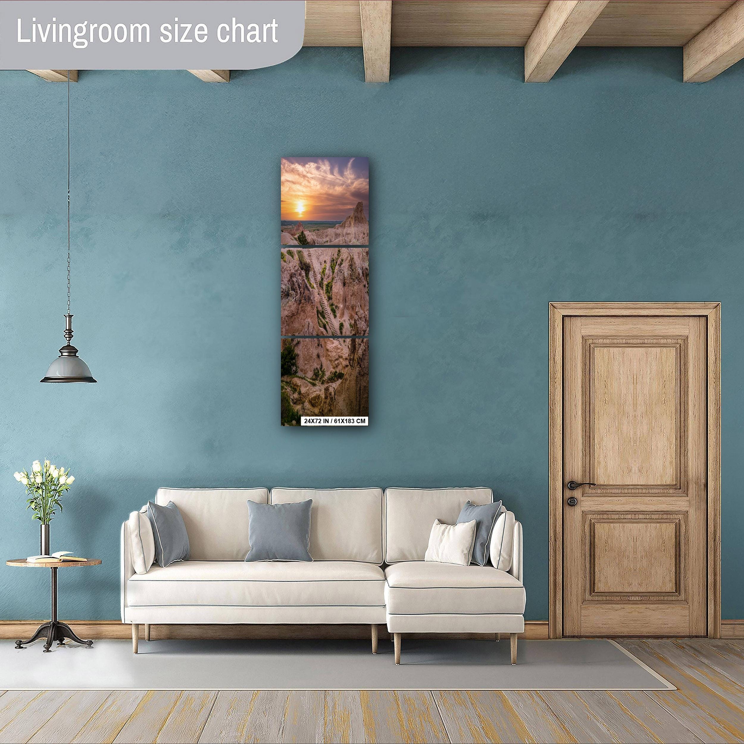Living room with a sofa, side table, and wall art against a blue wall.