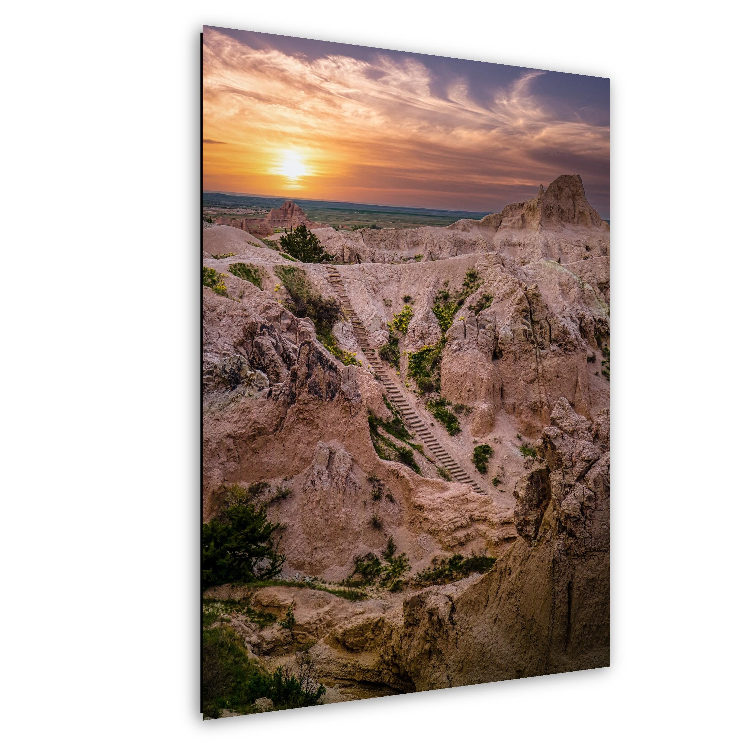 Sunset stairway in Badlands National Park with glowing spires and colorful sky