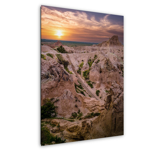 Sunset stairway in Badlands National Park with glowing spires and colorful sky