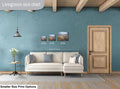 Living room with a sofa, side table, and wall art, featuring a size chart for prints.