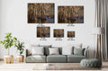 Living room with a sofa and decorative plants, featuring wall art with measurements.