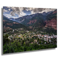 A breathtaking view of Ouray, Colorado, from the Million Dollar Highway, surrounded by the San Juan Mountains.