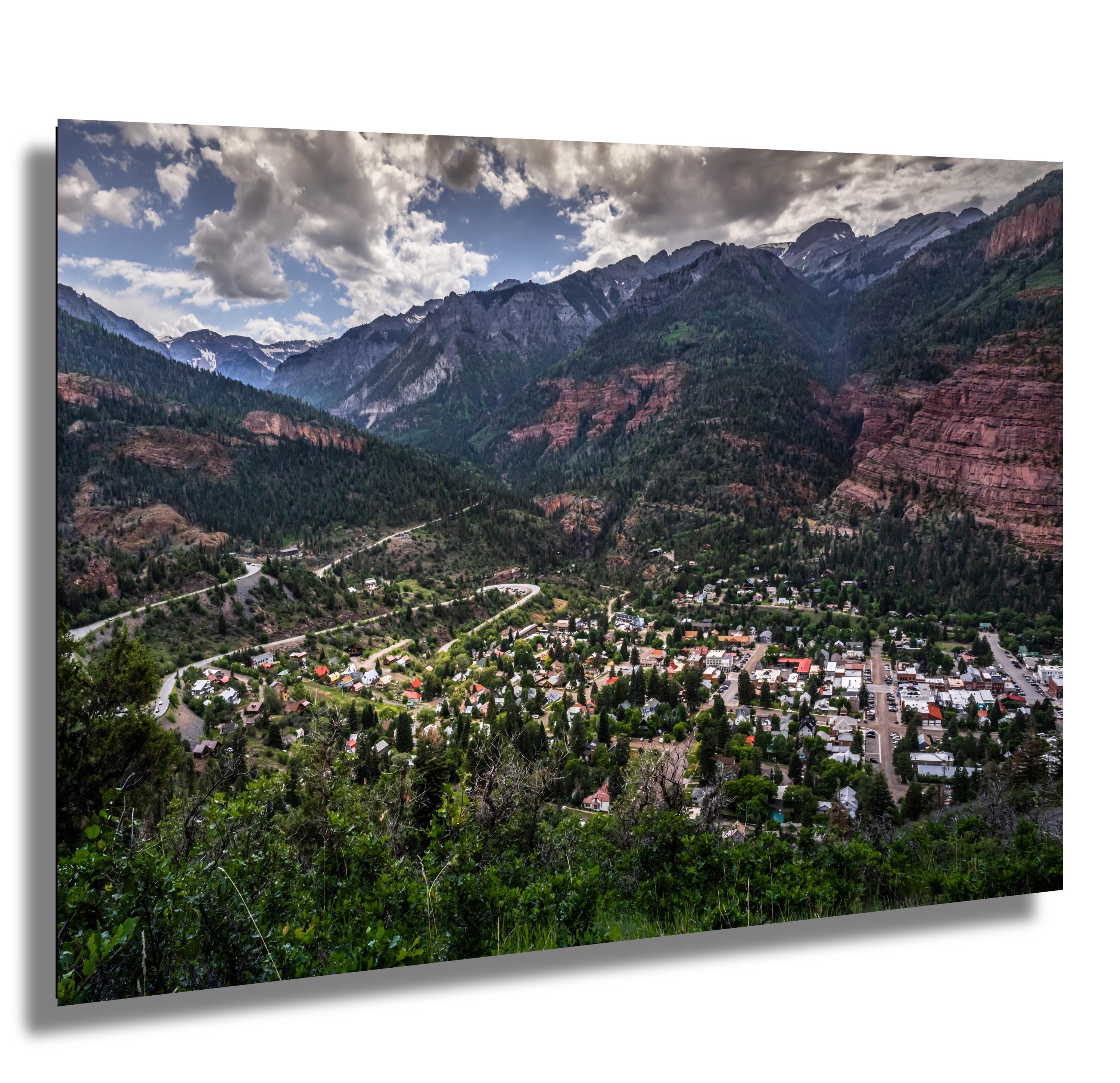 A breathtaking view of Ouray, Colorado, from the Million Dollar Highway, surrounded by the San Juan Mountains.