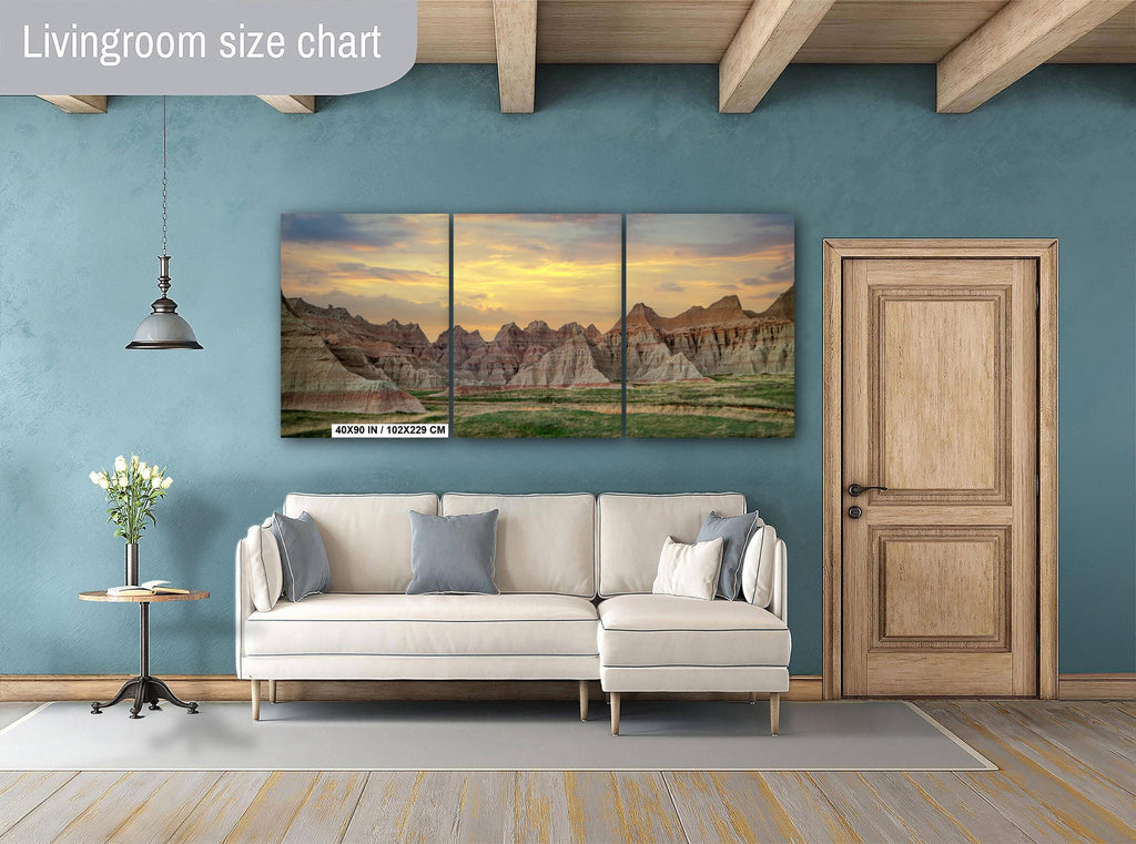Living room with a sofa, side table, and wall art depicting a mountain landscape.