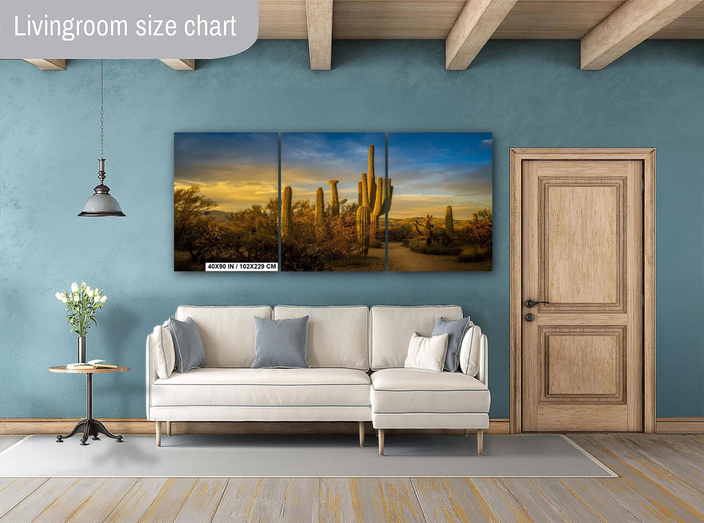 Living room with a sofa, side table, and wall art depicting cacti.