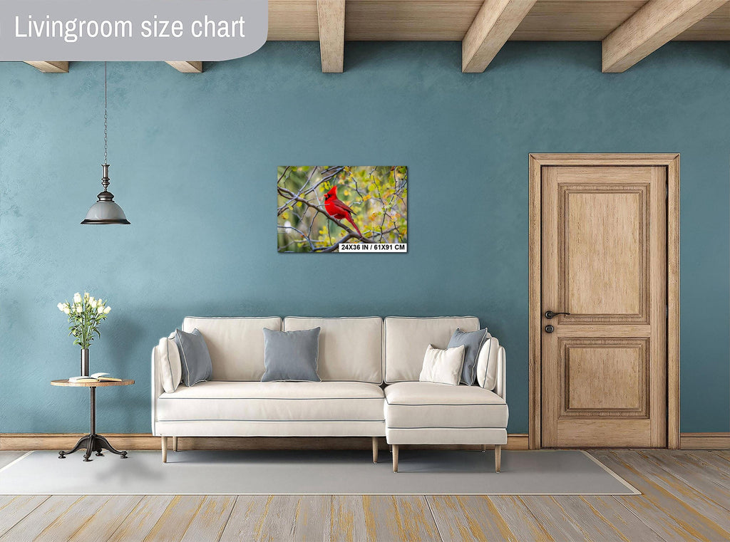 Living room with a beige sofa, side table, and wall art of a red bird.
