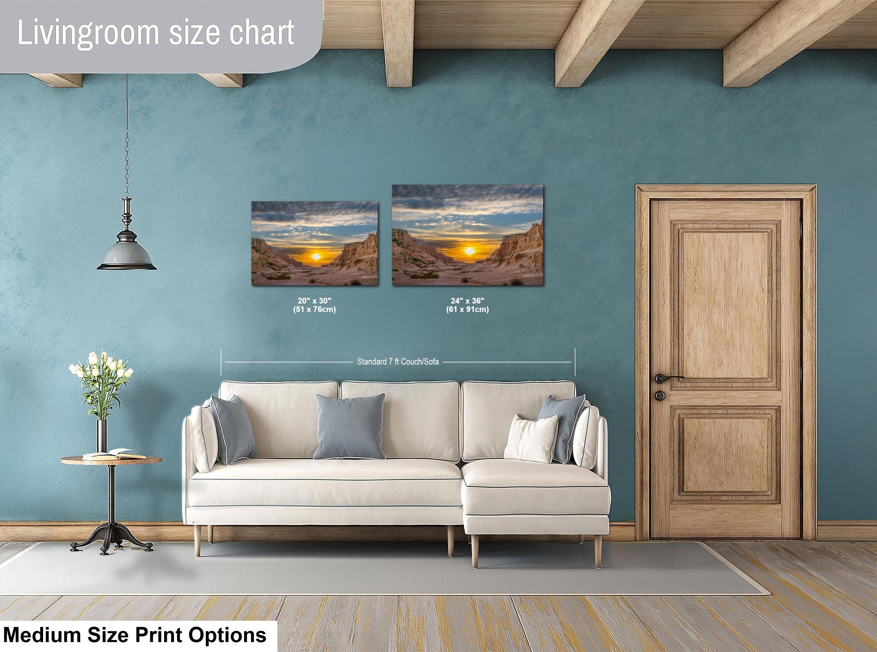Living room with two wall art prints above a sofa, showing size chart.