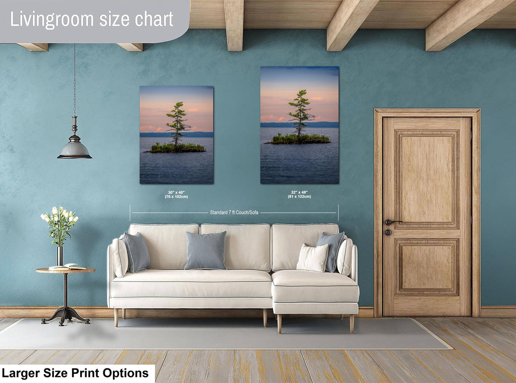 Living room with a sofa, side table, and two wall art prints on a blue wall.