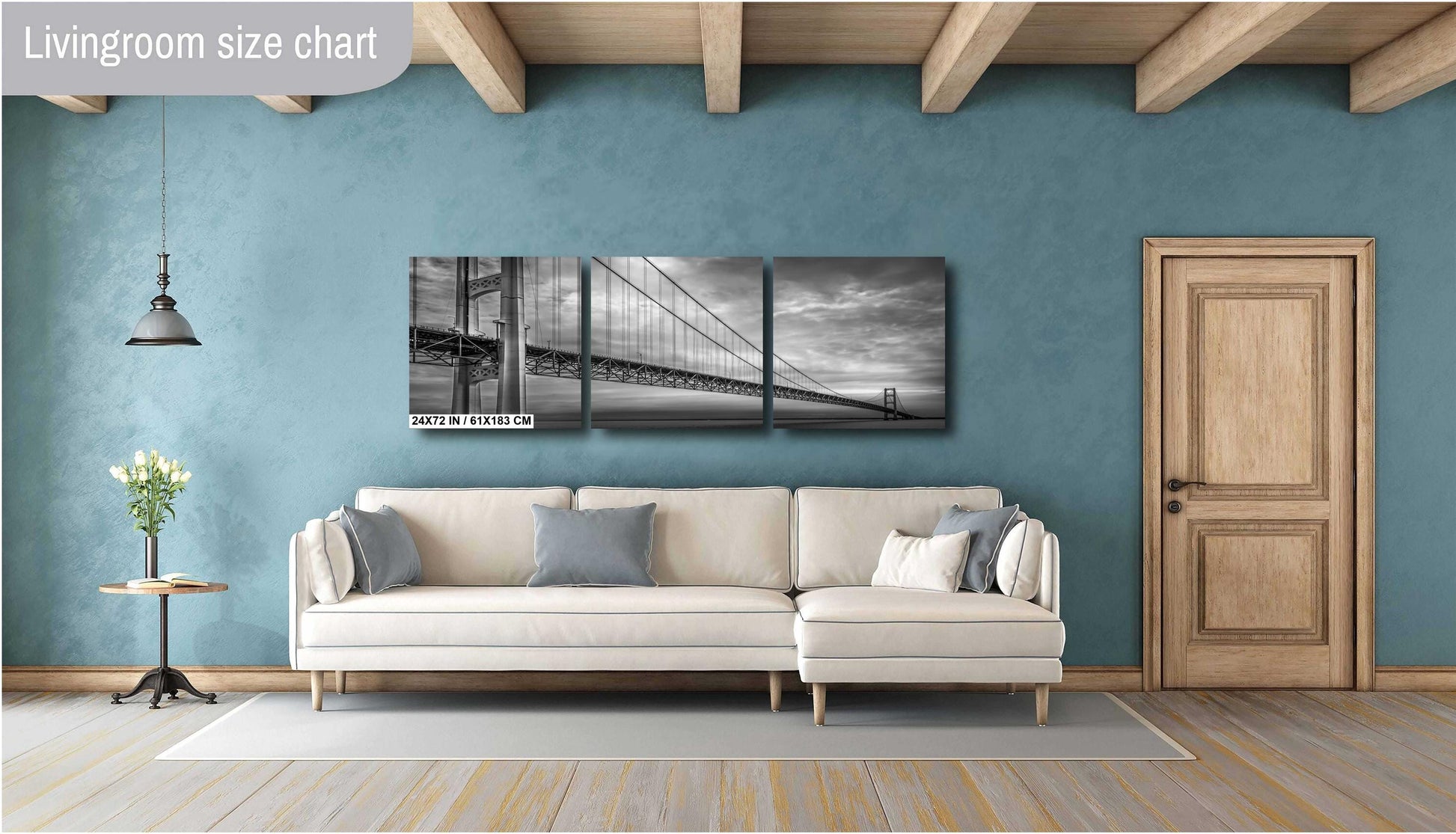 A black and white photograph of the Mackinac Bridge, capturing the engineering and grandeur of the structure with a backdrop of overcast sky and a body of water.