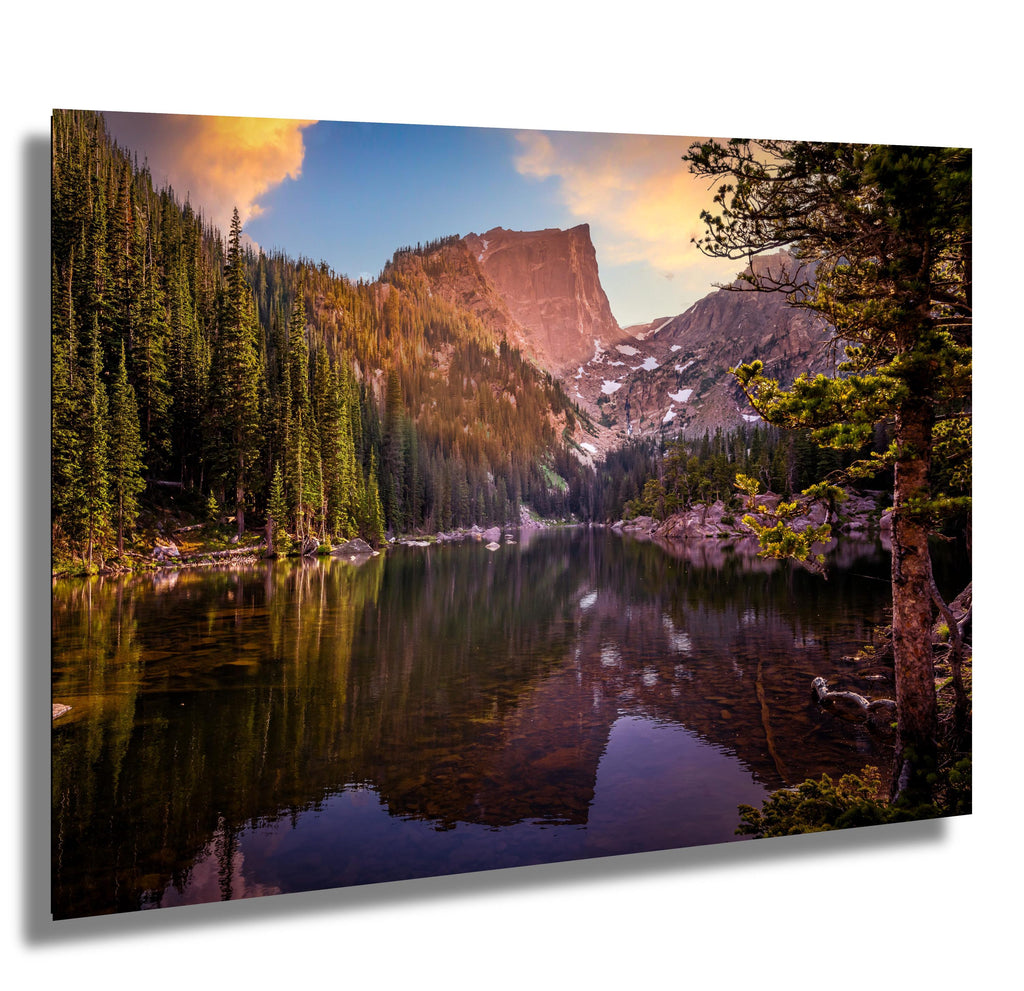 Sunrise at Dream Lake in Rocky Mountain National Park, reflecting Hallett Peak on calm waters.
