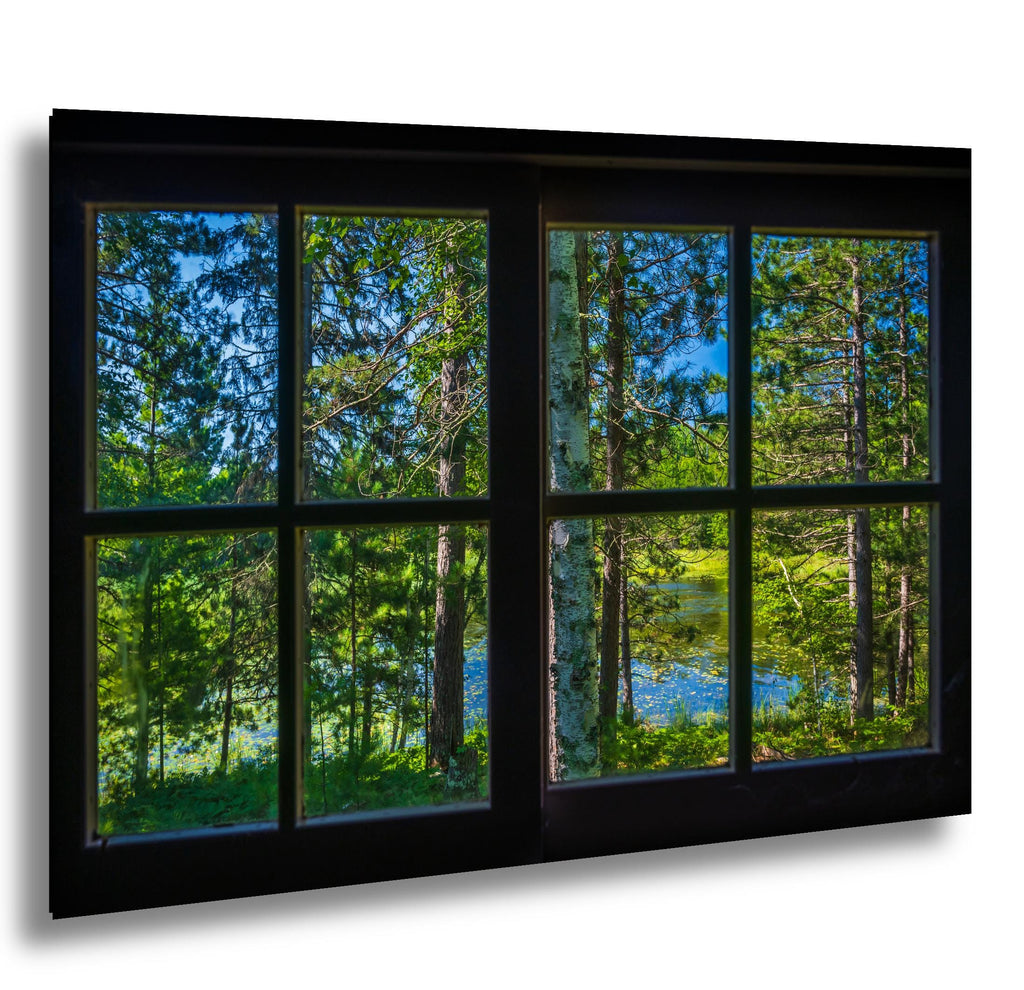 View of Namakan Lake through a rustic cabin window on Stevens Island in Voyageurs National Park.