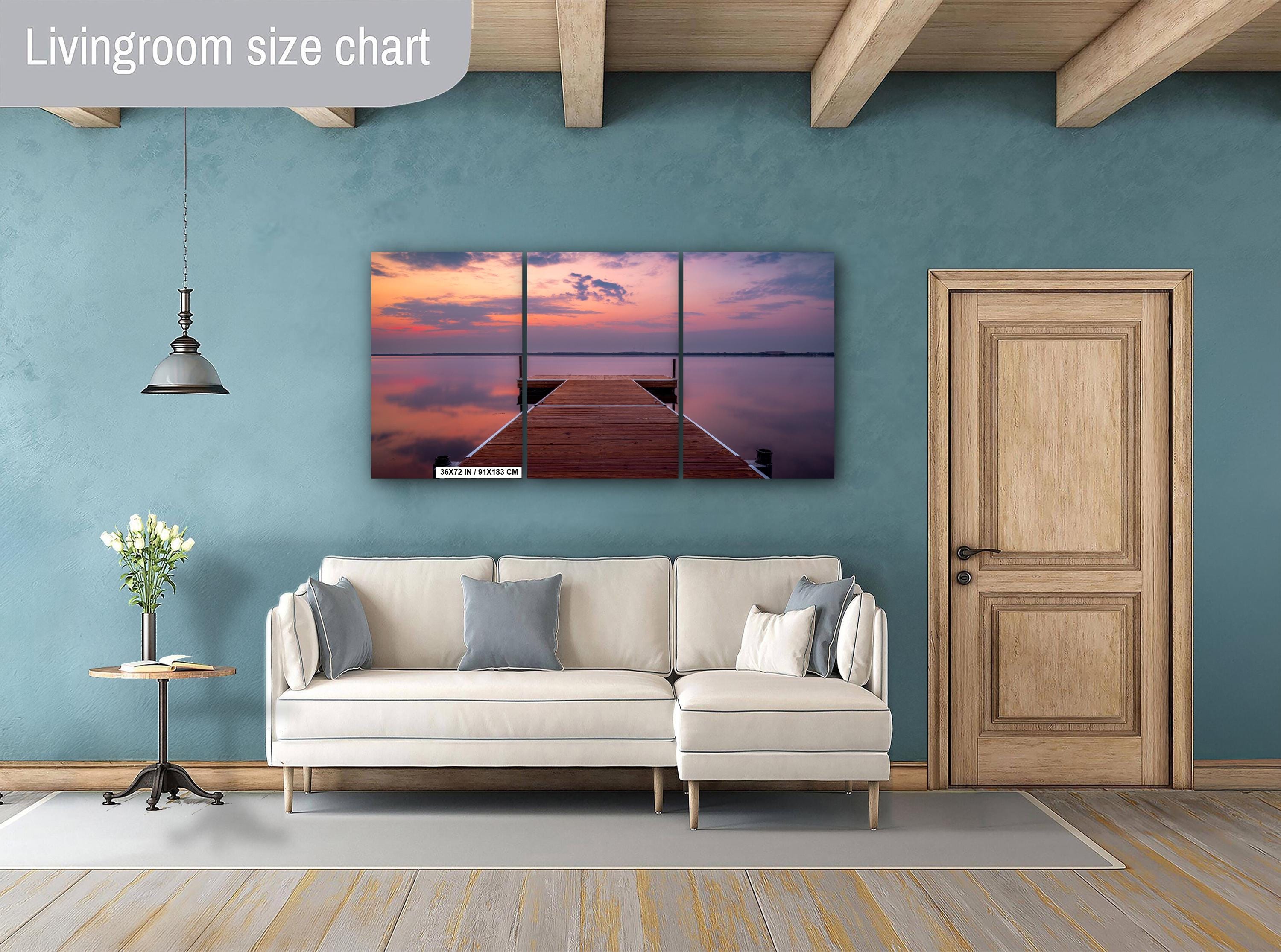 Sunset over calm Lake Bemidji with dock view and pastel skies before a summer storm 3-panel wall art hanging in living room.