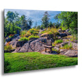 Stone marker at Ellsworth Rock Gardens with granite outcrops and wildflowers.