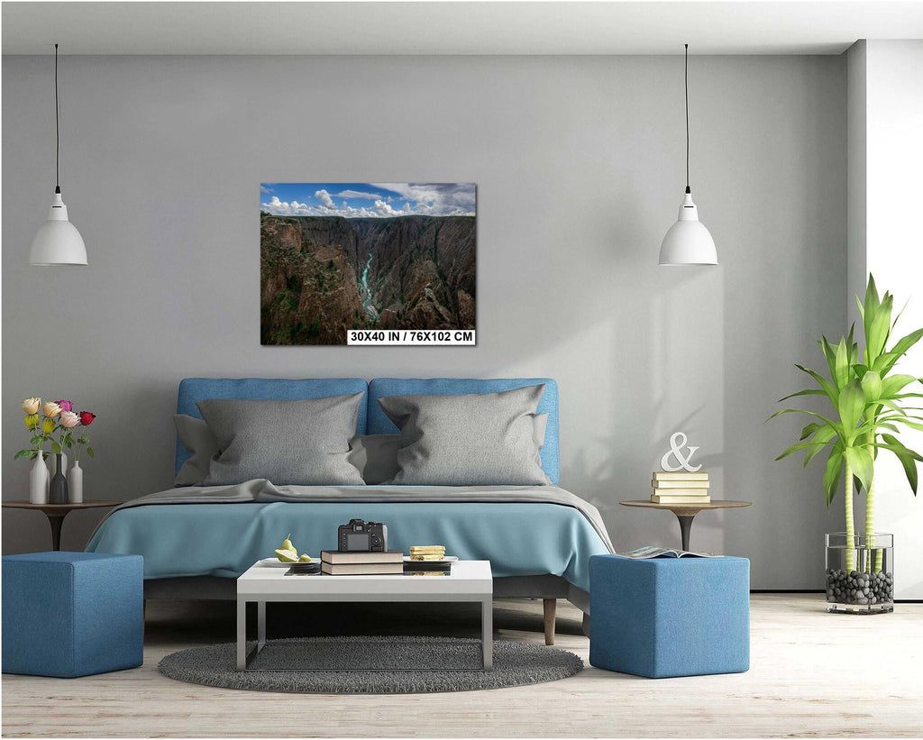 Modern living room with blue sofa, coffee table, and decorative items.