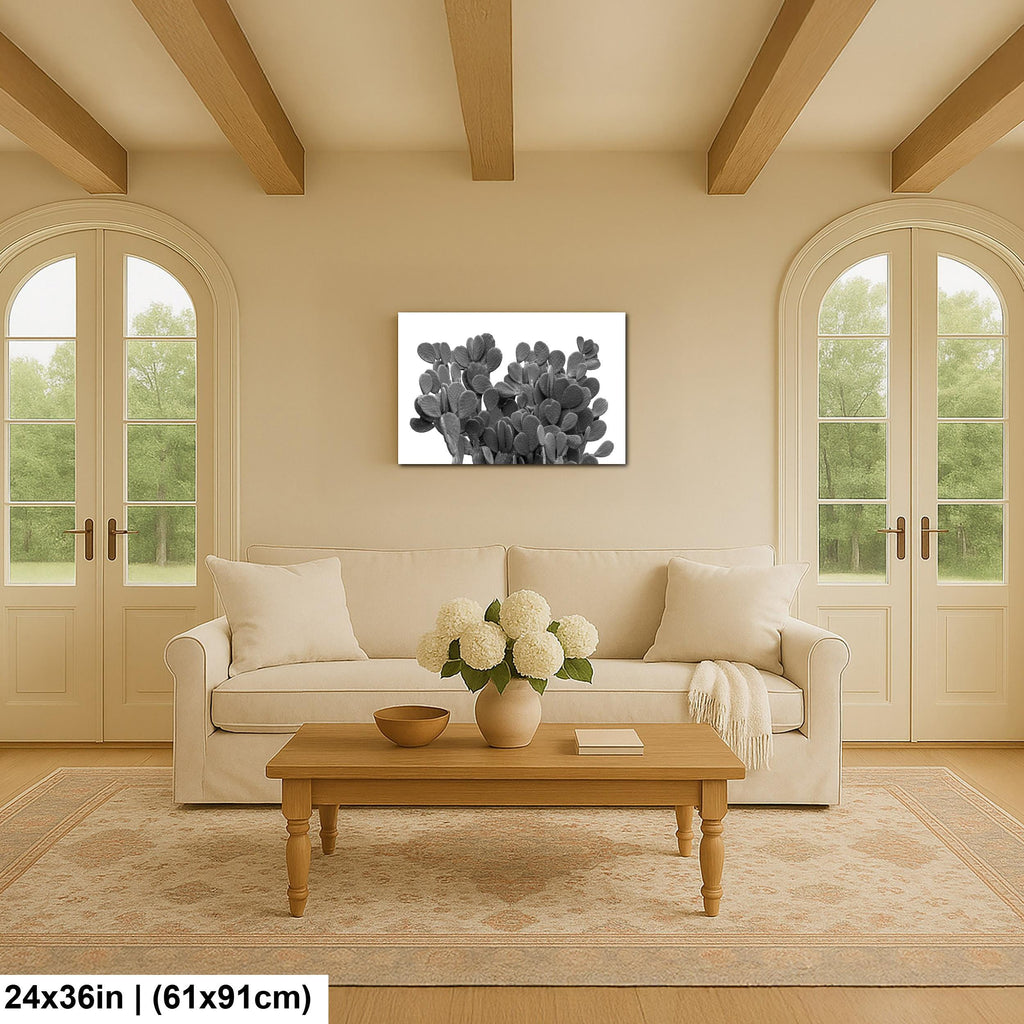 Living room with beige sofa, wooden coffee table, and cactus artwork on wall.