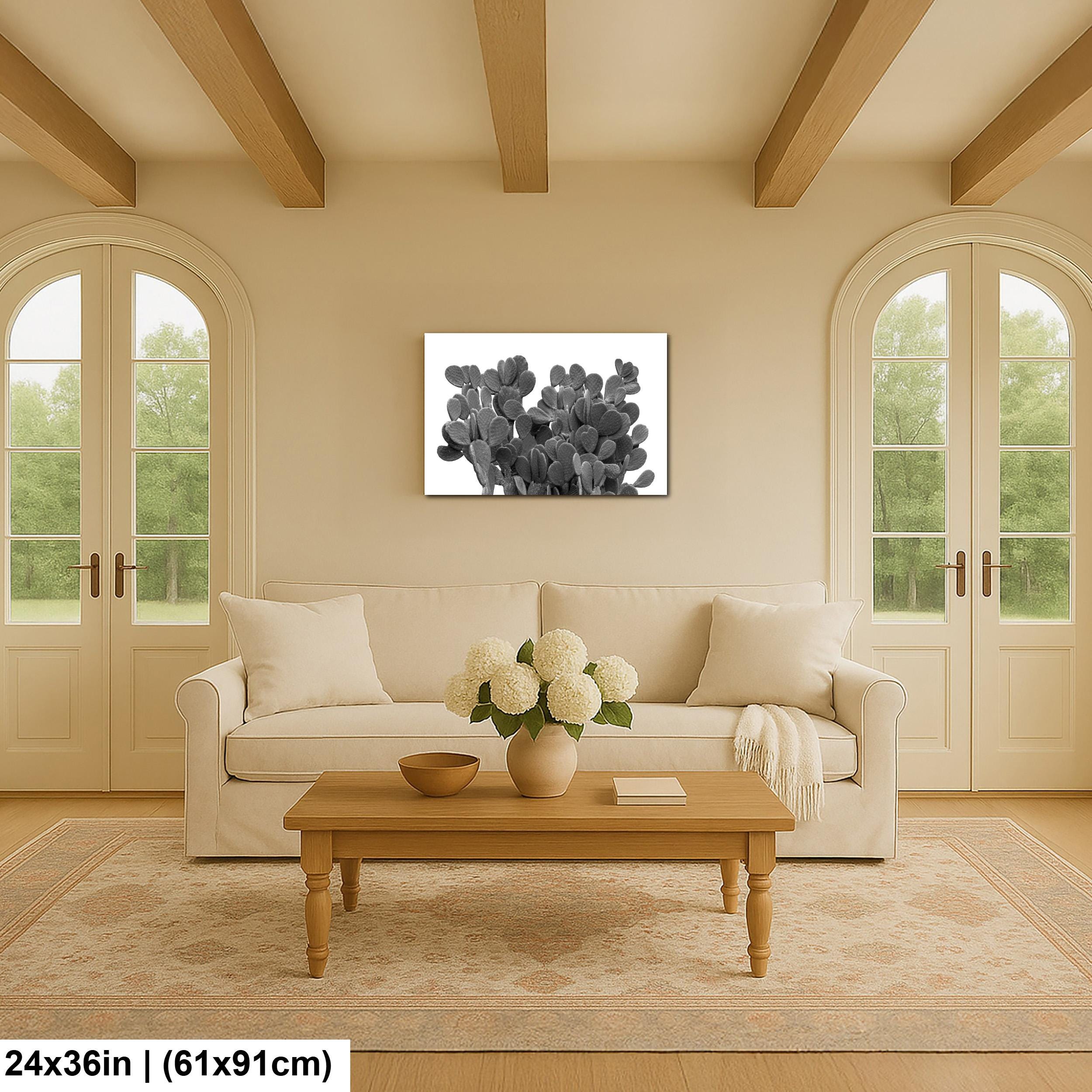 Living room with beige sofa, wooden coffee table, and cactus artwork on wall.