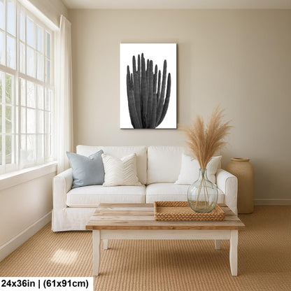 Living room with a white sofa, wooden coffee table, and wall art.