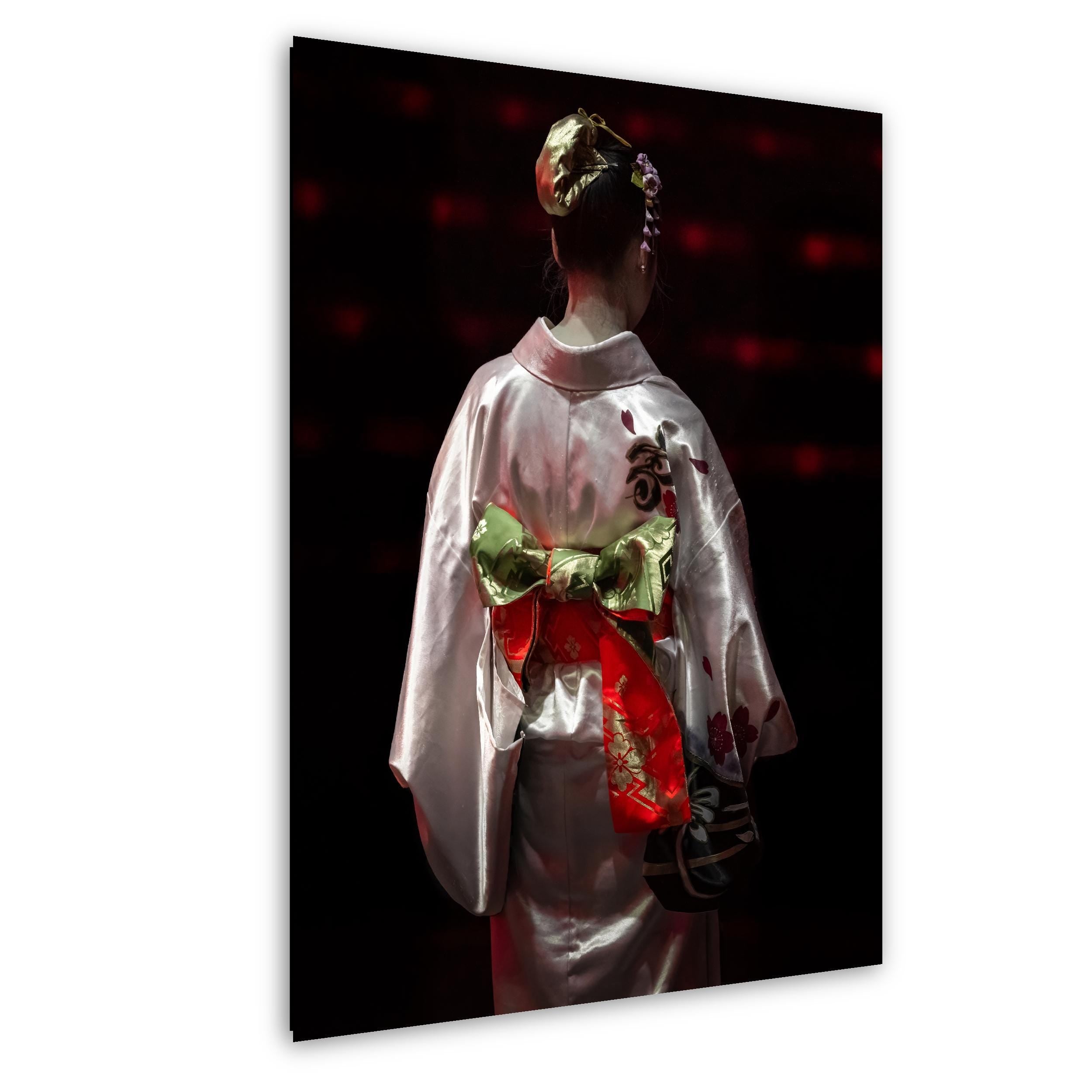 Photography print of a performer in a silk kimono with ornate obi, captured from behind under stage lighting