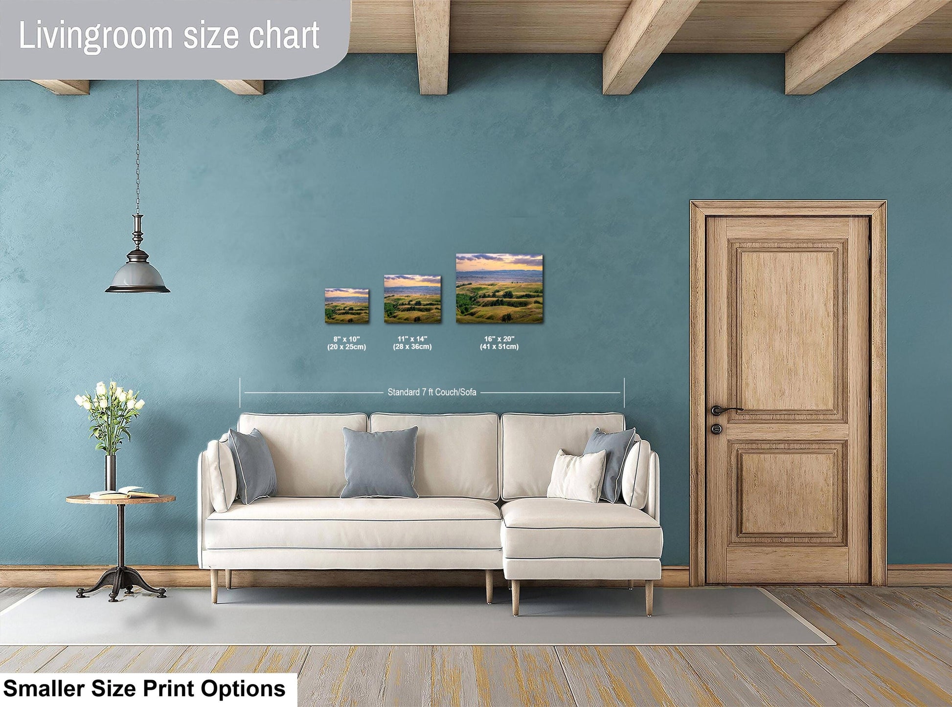 Living room with a sofa, side table, and wall art prints on a blue wall.