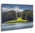 Scenic golf course on Lake Keowee surrounded by lush trees and calm waters