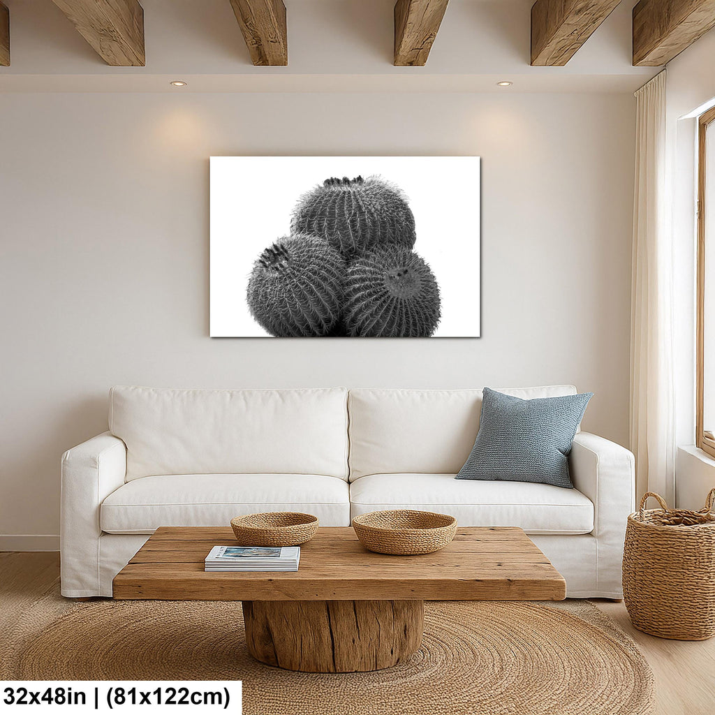 Modern living room with a white sofa, wooden coffee table, and decorative wall art.