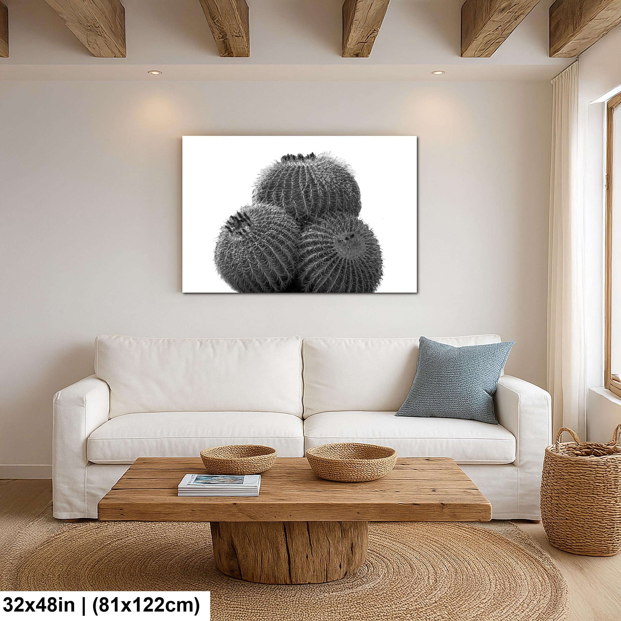Modern living room with a white sofa, wooden coffee table, and decorative wall art.