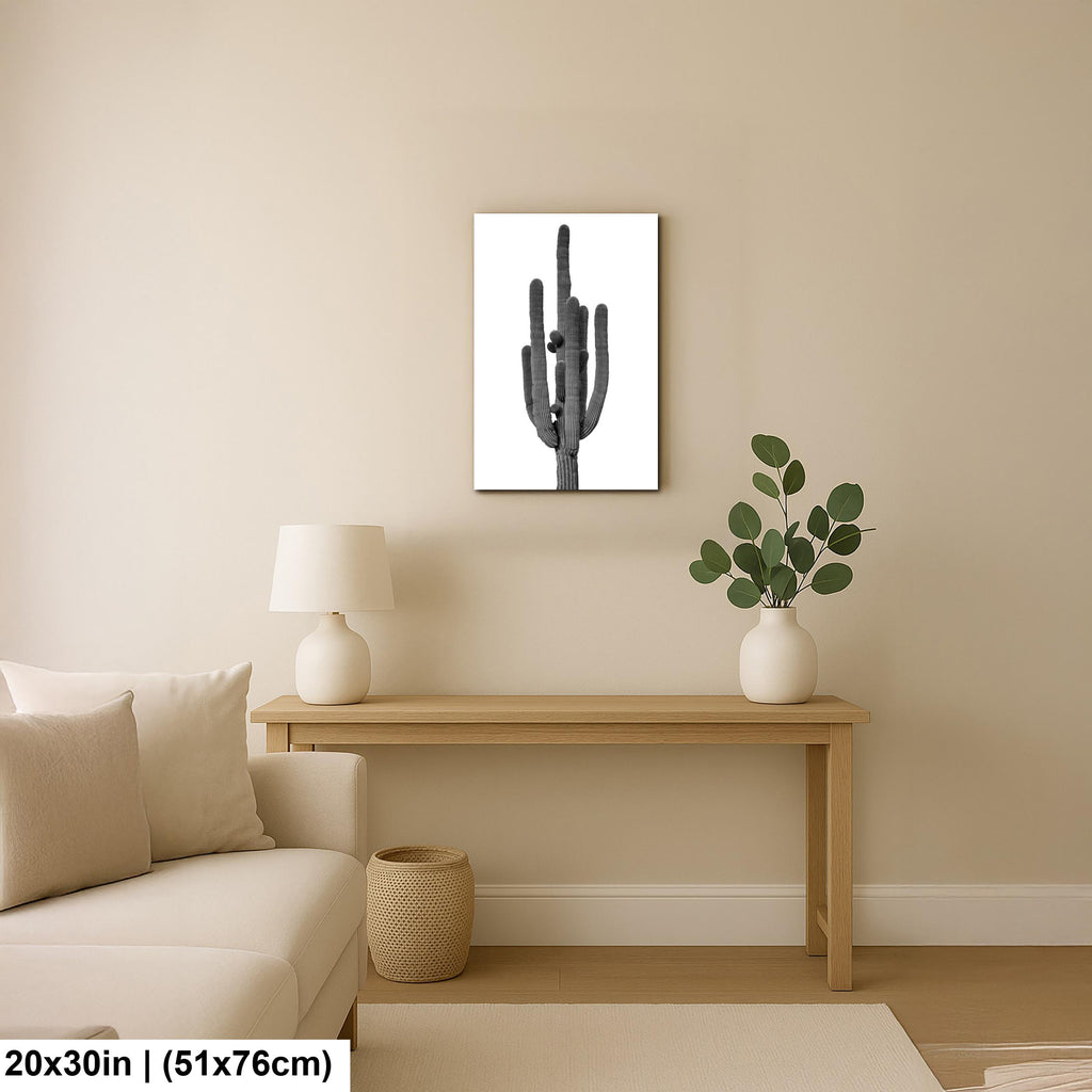 Living room with a cactus painting on the wall, a wooden console table with a lamp and plant, and beige walls.