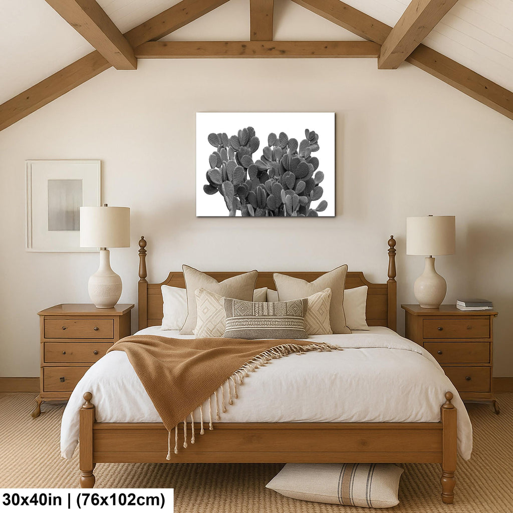 Bedroom with wooden bed, nightstands, and wall art of cacti.