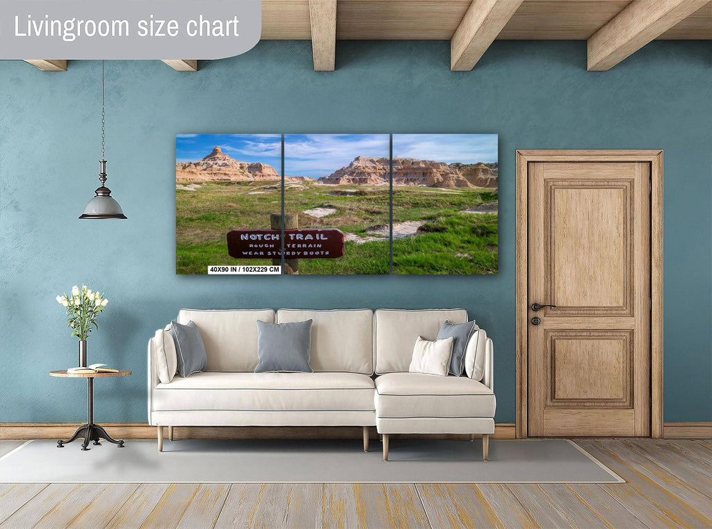 Living room with a large wall art piece depicting a scenic landscape.