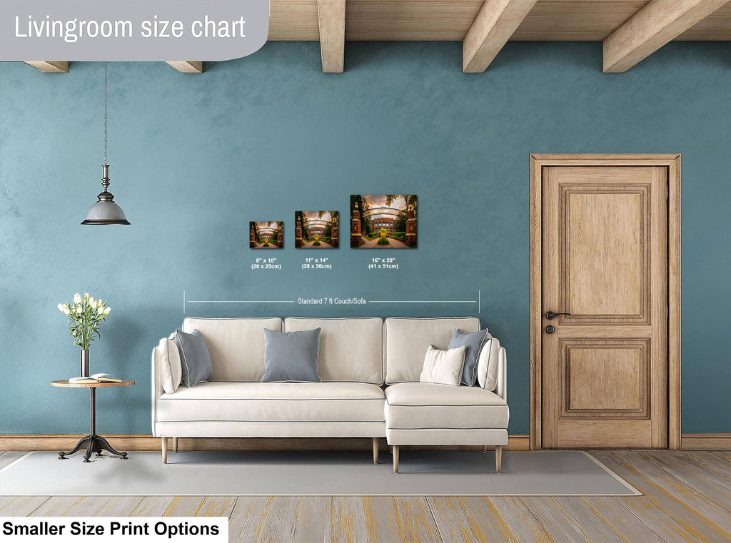 Living room with a sofa, side table, and wall art, featuring a size chart for prints.