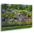 Ellsworth Rock Gardens with stone sculptures and blooming wildflowers.